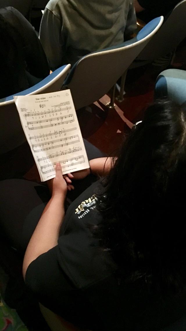 Students working on lyrics and technique.
